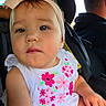 toddler, child, baby, headband, bow, white_dress, floral_embroidery, car_seat, car_interior, person, face, hand, seatbelt, driver, window, daylight, cute, portrait, young_child, sitting