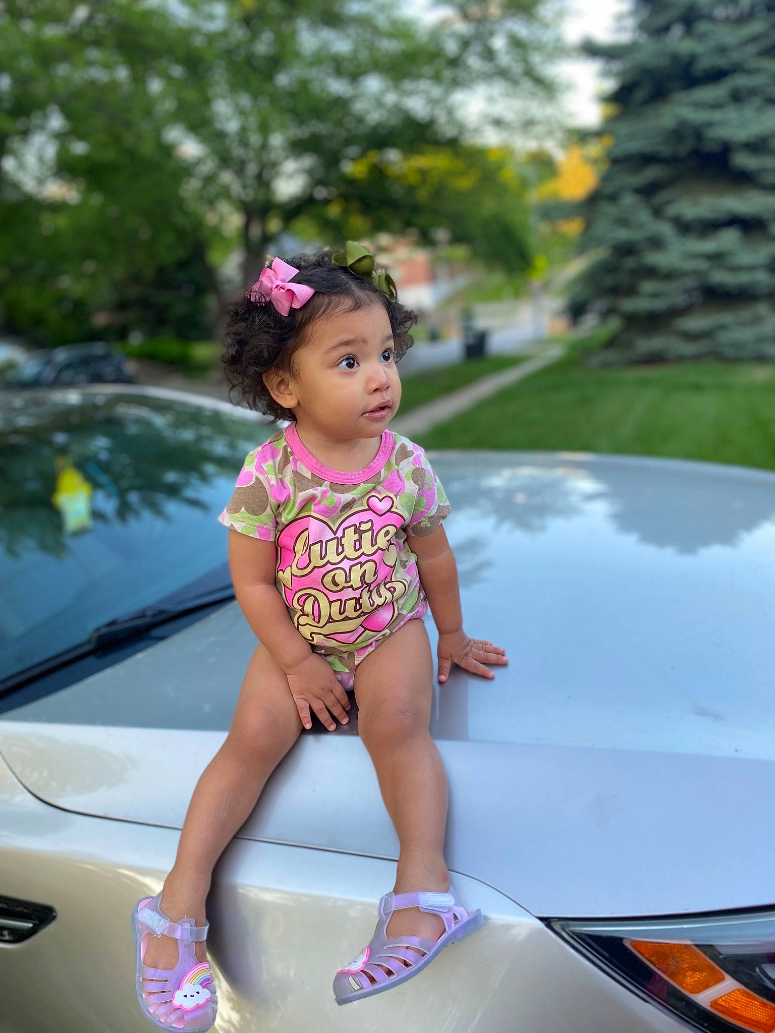 Aubrie joined the competition — help win amazing prizes! automotive_design, automotive_exterior, automotive_lighting, beauty, bumper, car, dress, hand, hood, leg, leisure, motor_vehicle, person, photograph, pink, plant, surprise, toddler, trunk, vehicle