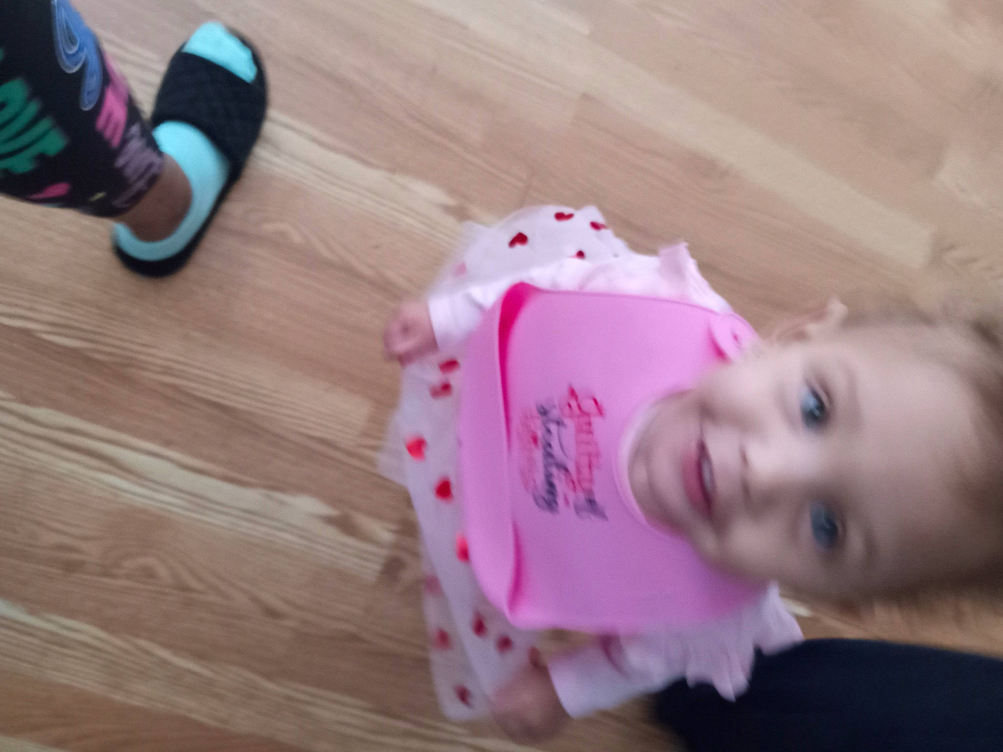 Royalty joined the competition — help win amazing prizes! baby, baby_toddler_clothing, cheek, child, floor, flooring, foot, fun, happy, hardwood, human_leg, iris, lip, magenta, person, pink, sleeve, smile, toddler, walking_shoe