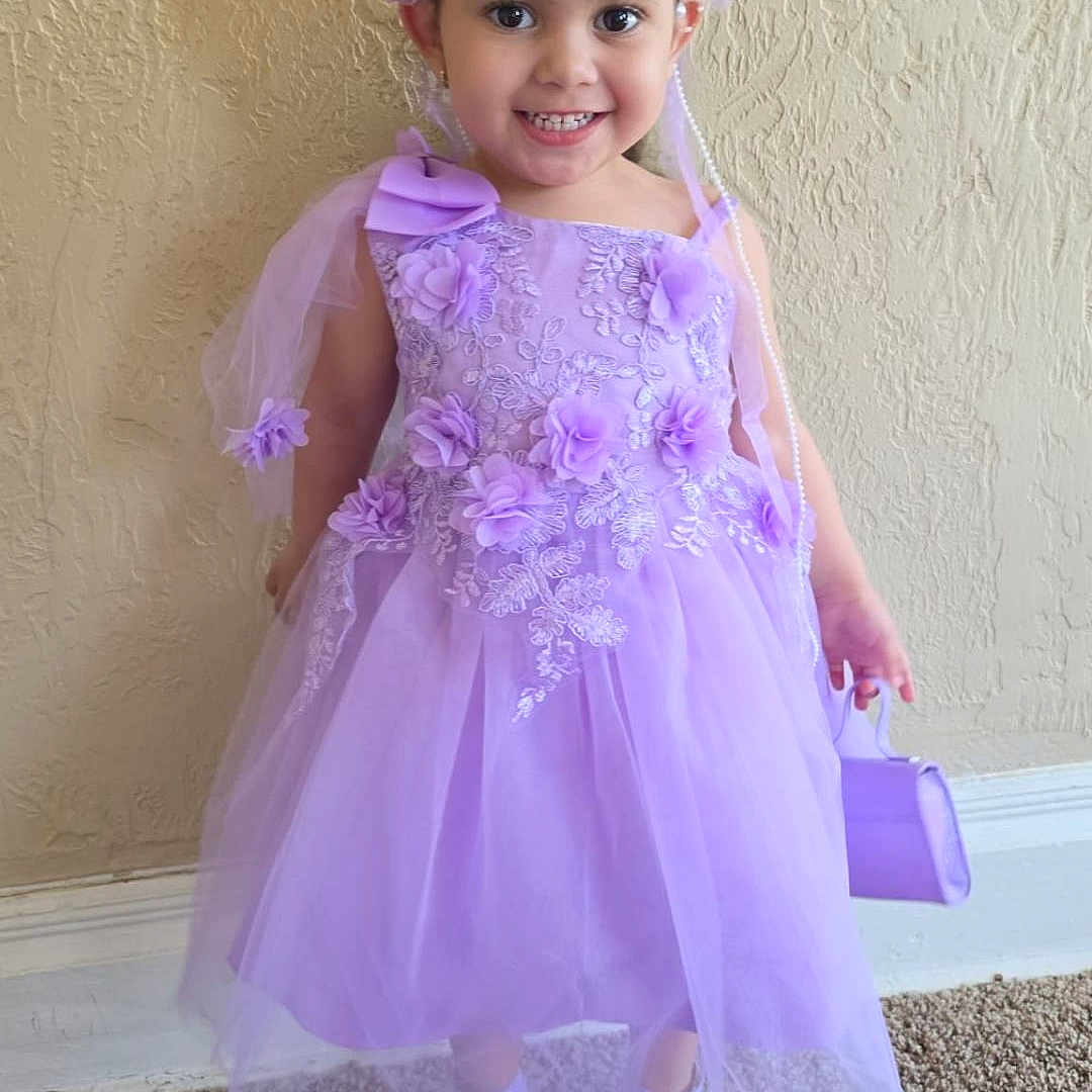 Emilyanis joined the competition — help win amazing prizes! child, girl, dress, lavender, flower_headband, smile, carpet, wall, indoor, shoes, purse, happy, portrait, tulle, fashion, person, cute, young, standing, accessory