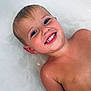 child, smiling, bathtub, water, wet_skin, happy, young, face, head, shoulder, skin, bath, childhood, portrait, person, candid, indoors, relaxing, joy, playful