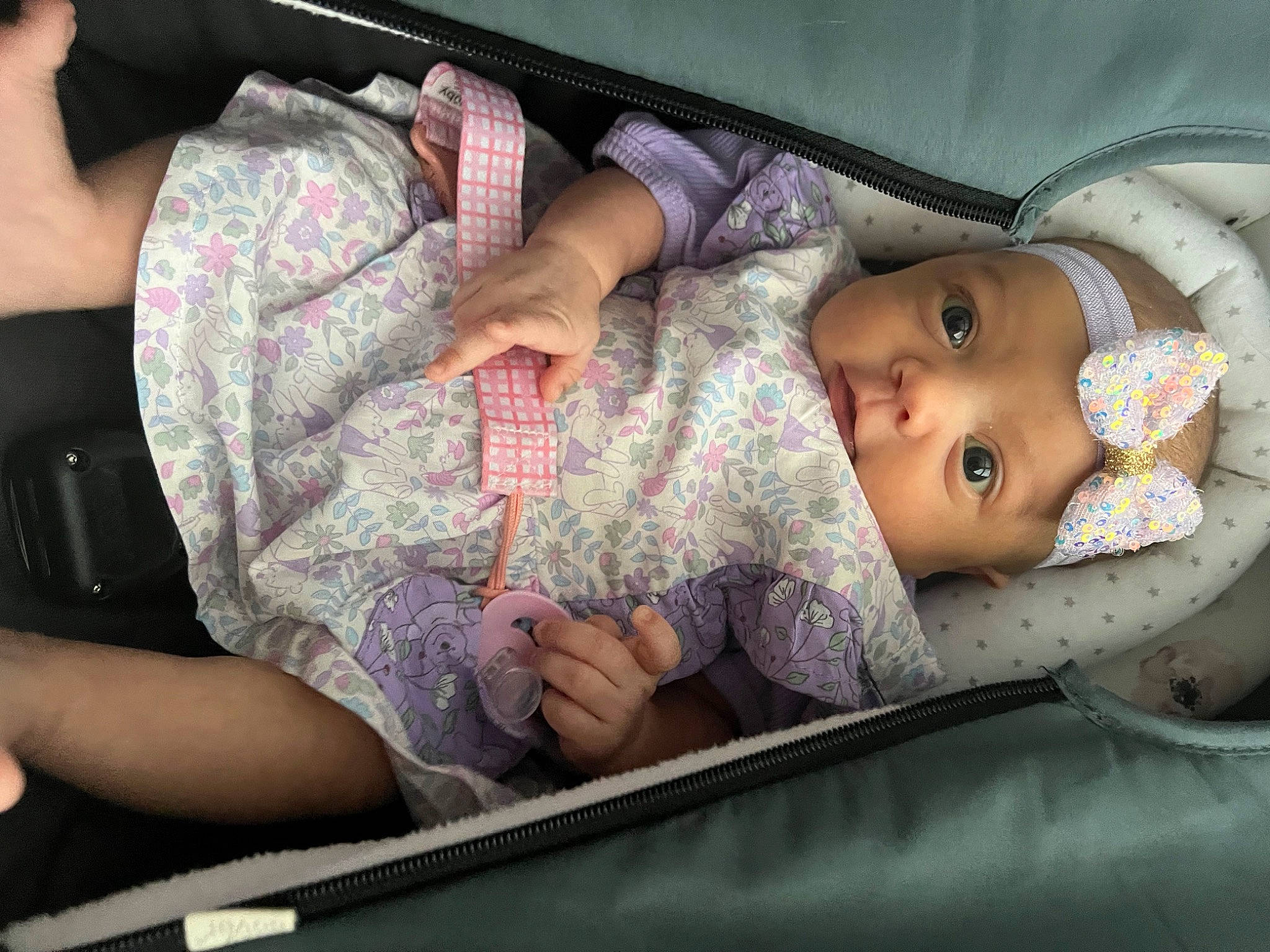 Gabriela is registered to the contest to win money with this photo: baby, baby_products, baby_safety, baby_toddler_clothing, cap, car_seat, cheek, child, comfort, elbow, facial_expression, gesture, headwear, human_body, human_leg, mouth, person, skin, thigh, thumb