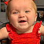 baby, child, smiling, happy, red_dress, hair_bows, high_chair, reflection, indoor, face, cute, infant, person, portrait, eyes, cheeks, clothing, window_blinds, door, home