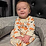 baby, bed, child, comfort, cozy, cushion, cute, face, hands, happy, head, indoors, infant, pajamas, portrait, pumpkin_pattern, sitting, sleepwear, smile, soft_toy