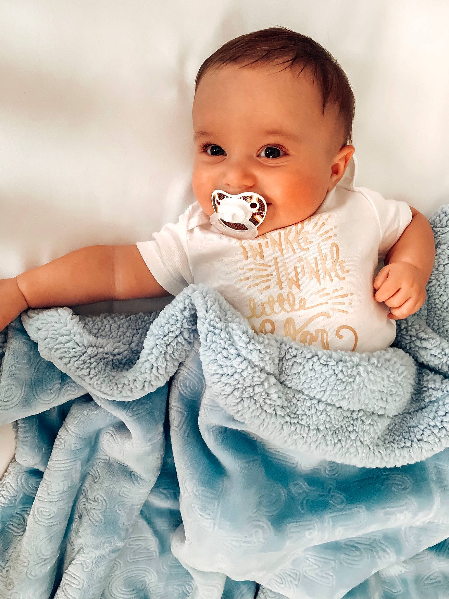 Larkin is registered to the contest to win money with this photo: baby, baby_products, baby_toddler_clothing, cheek, child, joy, linens, nose, person, product, skin, sleeve, textile, toddler