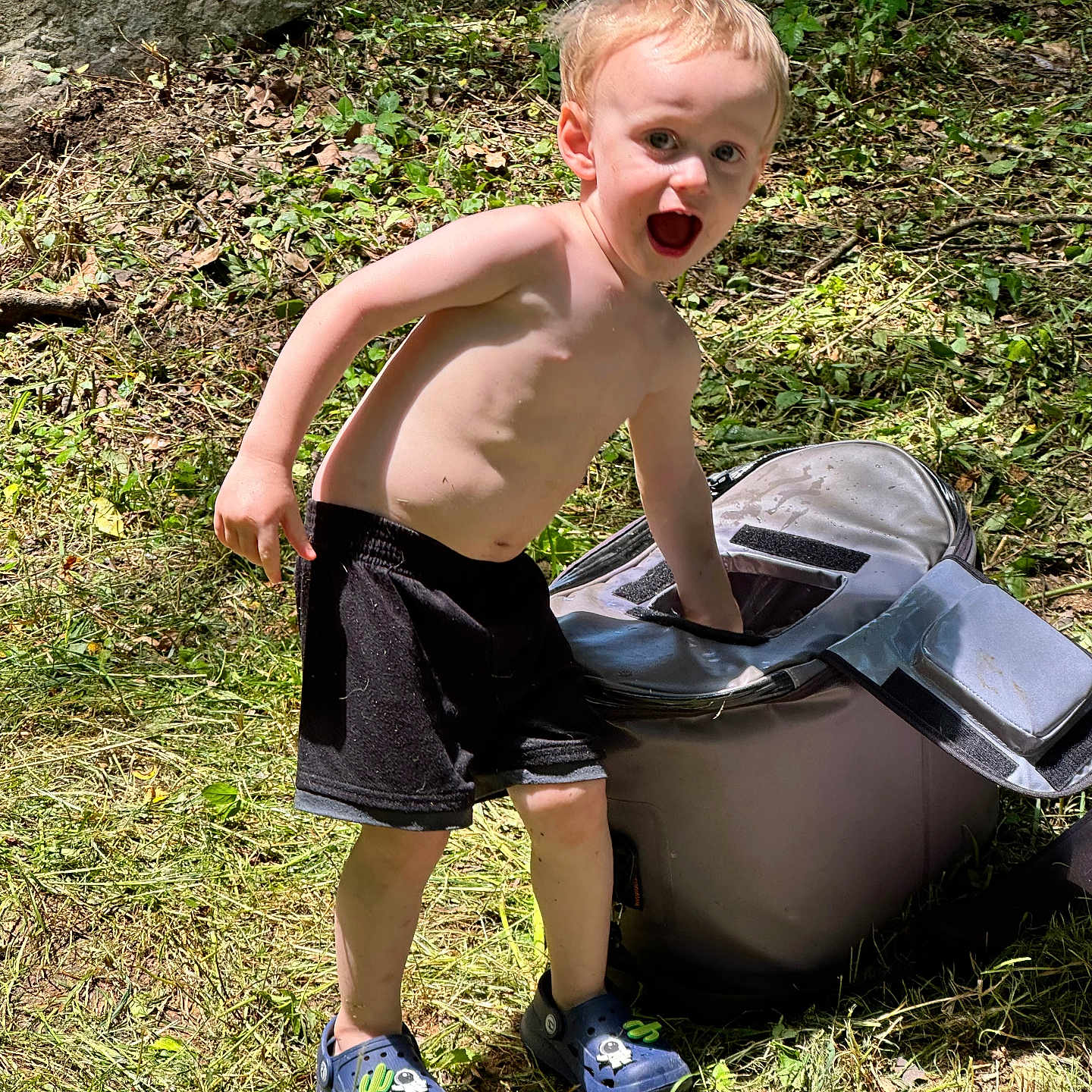 Maxwell joined the competition — help win amazing prizes! boy, child, clothing, face, footwear, grass, head, male, nature, outdoors, person, photography, plant, portrait, rock, shoe, shorts, sneaker, soil, summer