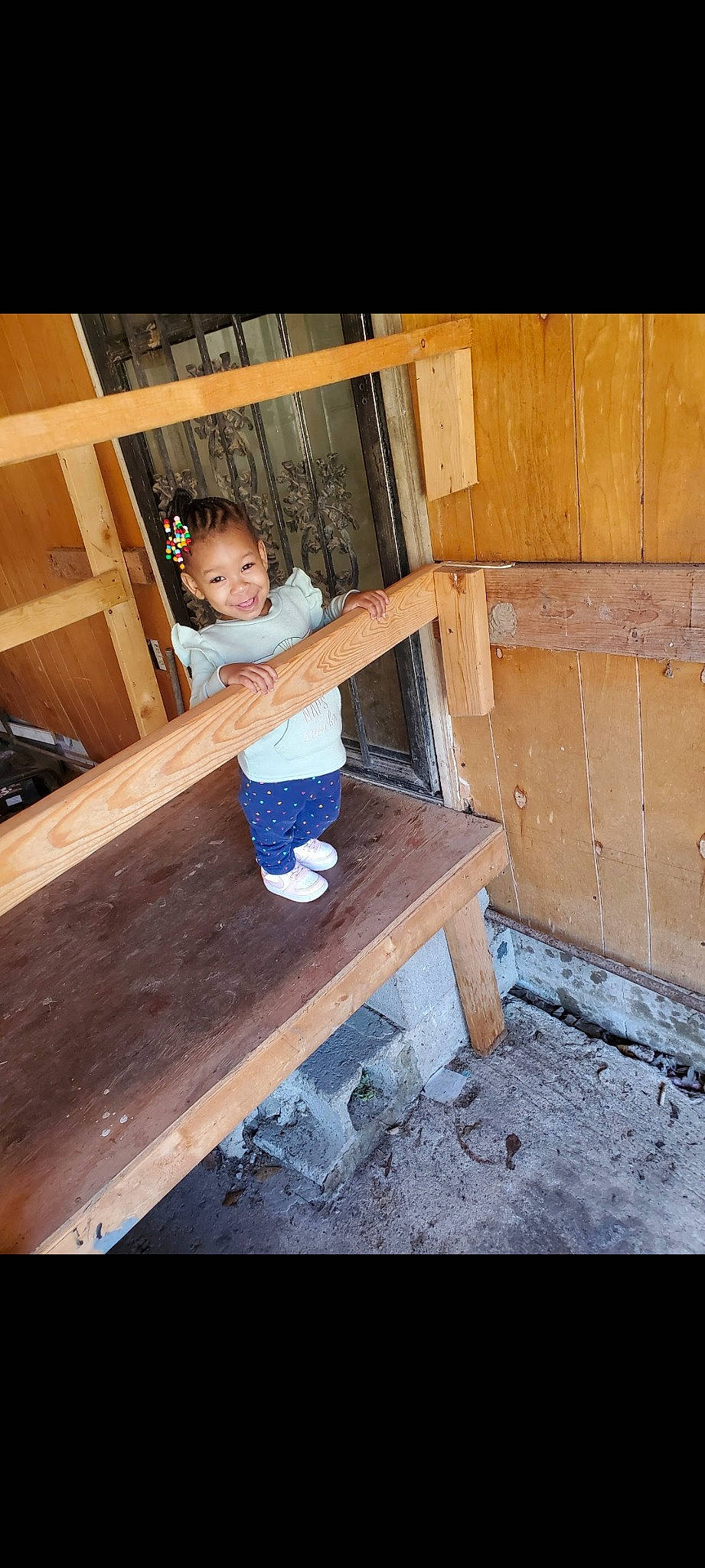 Avani joined the competition — help win amazing prizes! baby_toddler_clothing, child, electric_blue, flooring, fun, hardwood, human_body, human_leg, joy, leg, leisure, outdoor_furniture, person, rectangle, room, shorts, sitting, table, thigh, toddler