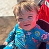 Corbin joined the competition — help win amazing prizes! toddler, child, smile, blue_onesie, space_theme, stroller, red_stroller, outdoor, sunlight, happy, face, hair, seatbelt, baby, portrait, daylight, person, cute, infant, young_child