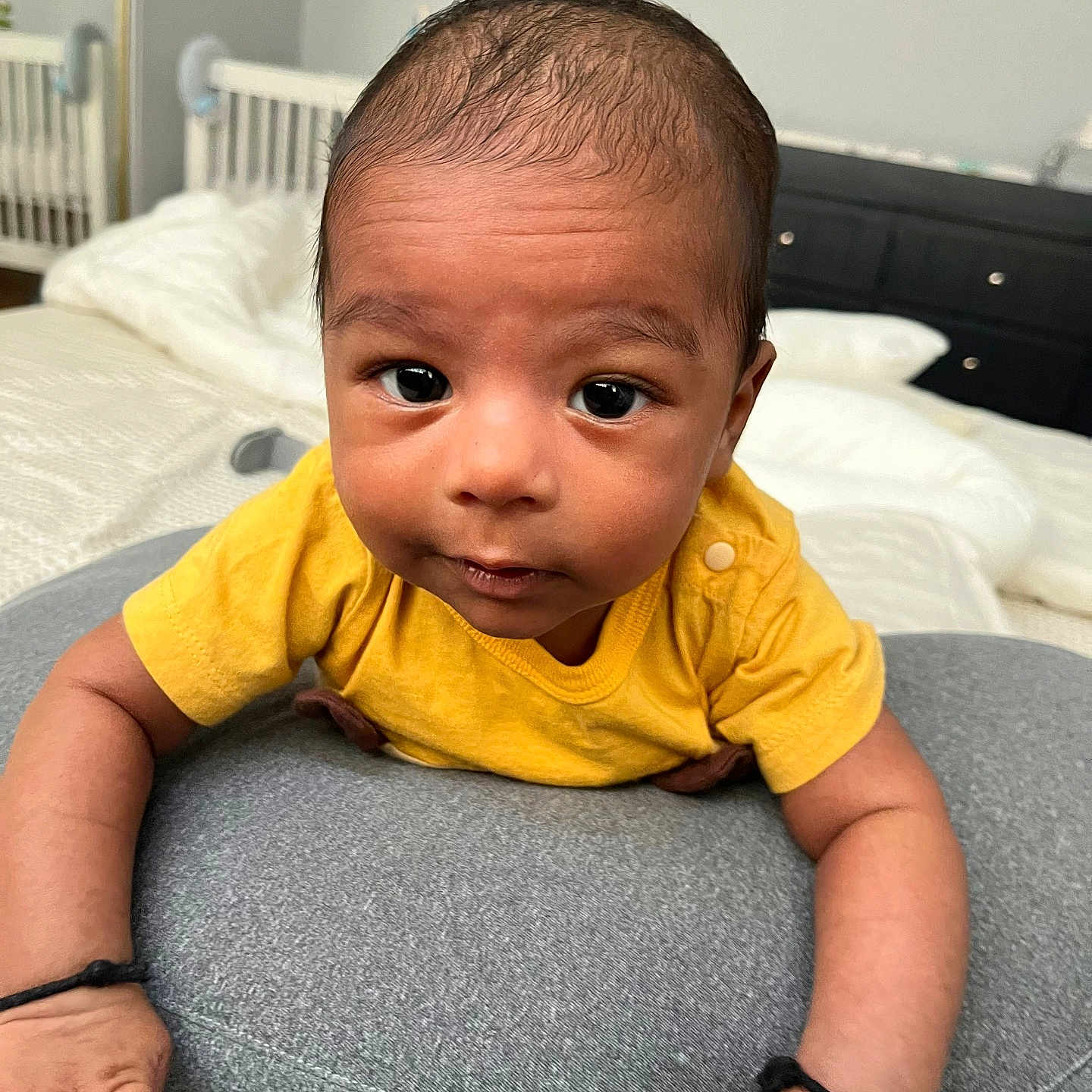 Vikrant is registered to the contest to win money with this photo: baby, bodypart, clothing, couch, cushion, face, finger, furniture, hand, happy, head, homedecor, indoors, pants, person, photography, portrait, sitting, sleeve, smile