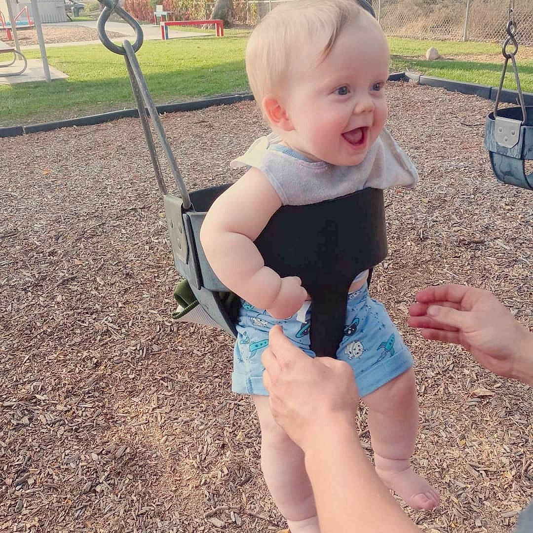 Lyric is registered to the contest to win money with this photo: baby, baby_toddler_clothing, eye, facial_expression, grass, happy, human_body, human_leg, leisure, person, plant, playground, shorts, skin, sleeve, smile, standing, t_shirt, thigh, toddler