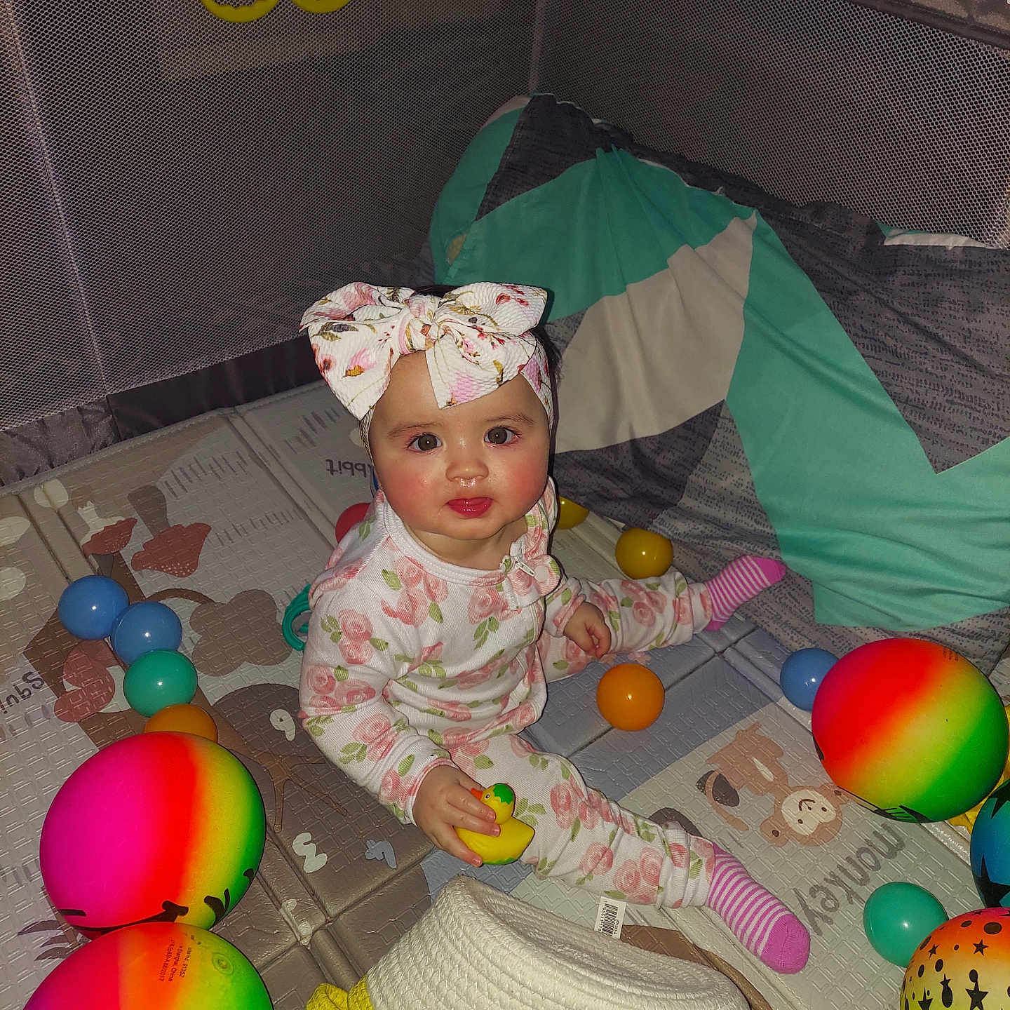 Aurora is registered to the contest to win money with this photo: baby, balloon, bonnet, cap, clothing, costume, couch, crib, dress, egg, face, food, furniture, hat, head, infantbed, person, photography, portrait, sphere