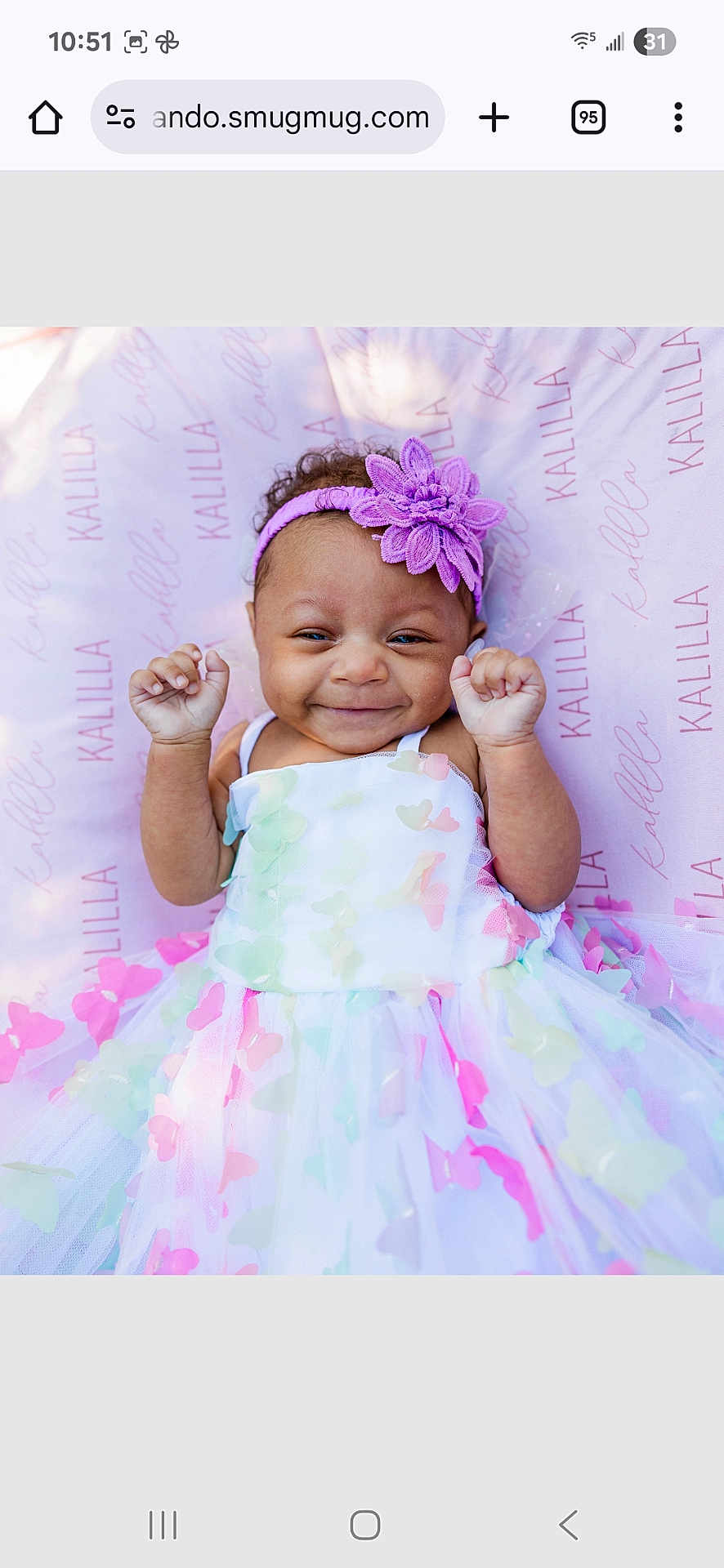 Kalilla is registered to the contest to win money with this photo: baby, blanket, butterfly, child, close_up, curly_hair, custom_print, cute, dress, flower, hands_up, happy, headband, infant, lying_down, name_print, pastel_colors, portrait, smiling, soft_lighting