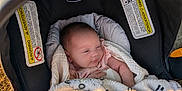 Pennelopea is registered to the contest to win money with this photo: newborn, baby, blanket, car_seat, chicco, outdoor, infant, cozy, sleepy, child, soft_light, baby_toy, nature, peaceful, portrait, wrapped, cute, small, resting, warm