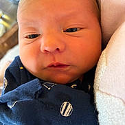 Everett joined the competition — help win amazing prizes! baby, blanket, blue_blanket, child, closeup, cozy, cute, eyes, face, indoors, infant, newborn, newborn_clothing, person, portrait, skin, sleepy, soft_lighting, space_theme, swaddled