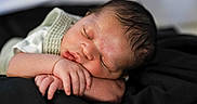 Jaziar is registered to the contest to win money with this photo: newborn, baby, sleeping, infant, peaceful, hands, face, skin, soft, blanket, rest, closeup, portrait, cute, newborn_clothing, baby_sleep, head, peace, child, toddler