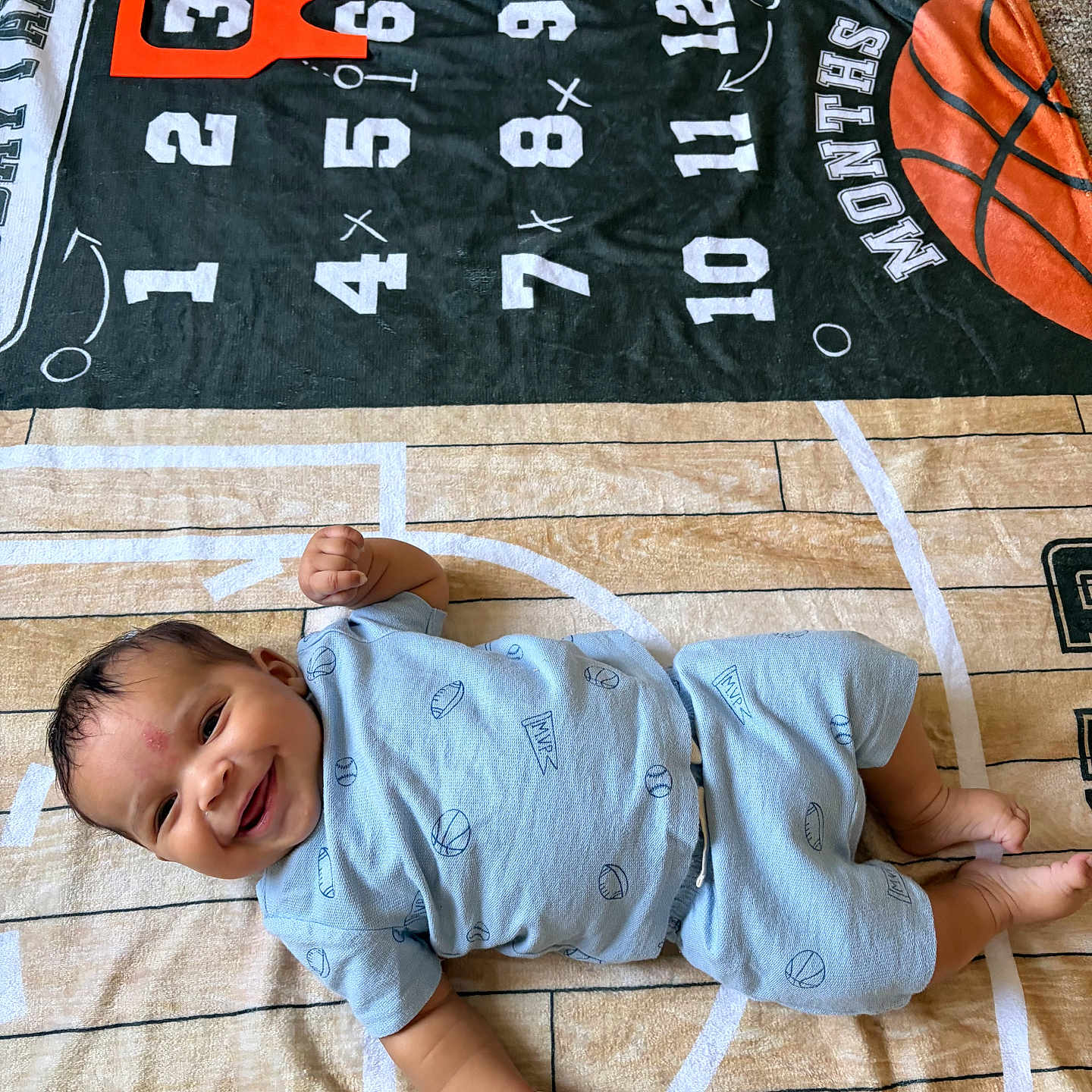 Jaziar joined the competition — help win amazing prizes! baby, smiling, infant, blue_clothing, basketball, blanket, sports_theme, months, happy, lying_down, floor, carpet, cute, child, young, portrait, indoor, toddler, baby_girl, baby_boy