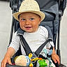 Léon participe au concours pour gagner de l'argent avec cette photo : baby, blue_eyes, child, clothing, cute, hand, happy, hat, indoor, infant, person, playful, plush_toy, portrait, safety_harness, seat, smile, straps, stroller, toddler