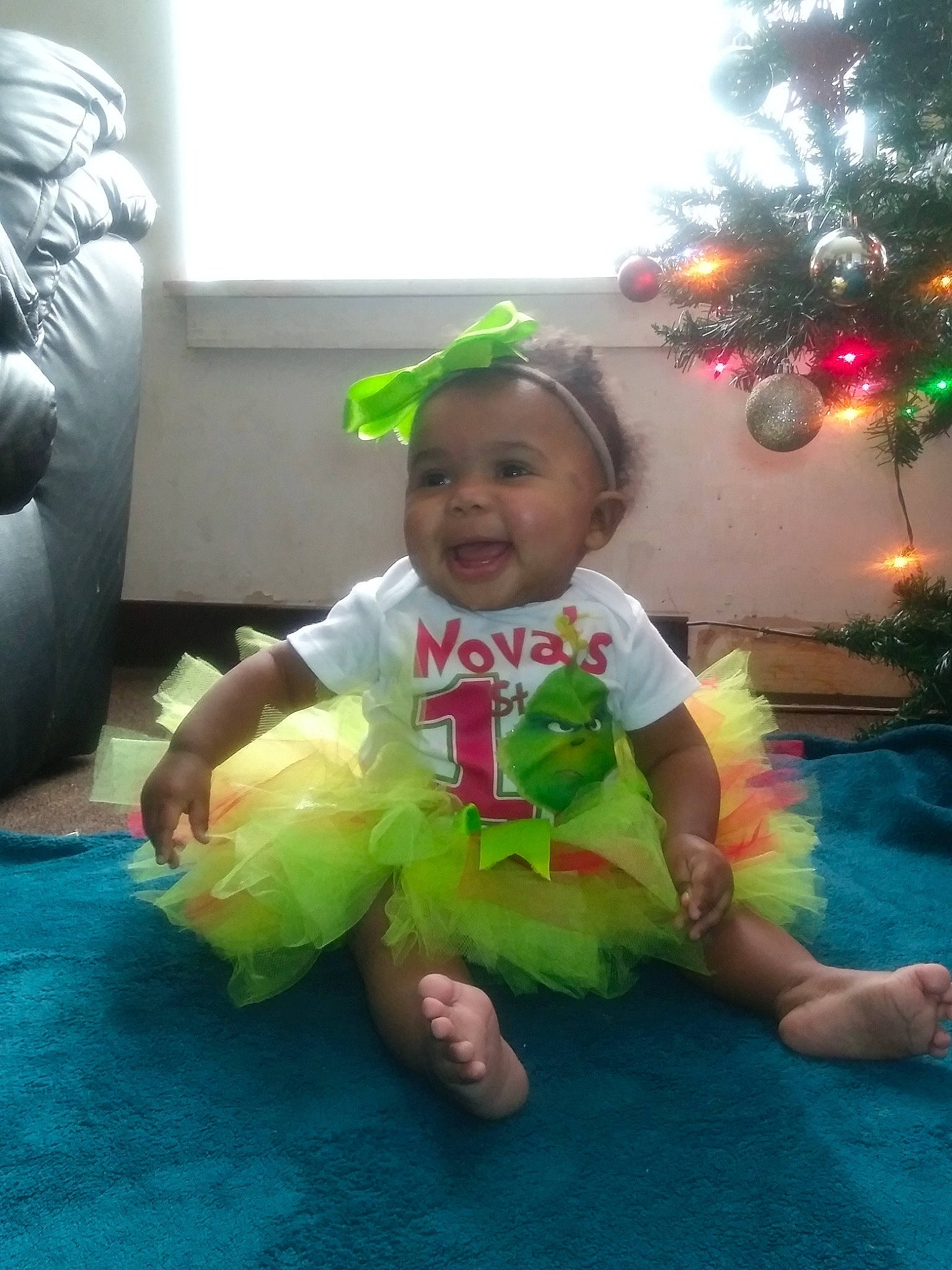Nova Reign is registered to the contest to win money with this photo: baby, child, costume, fun, green, person, play, skin, smile, toddler