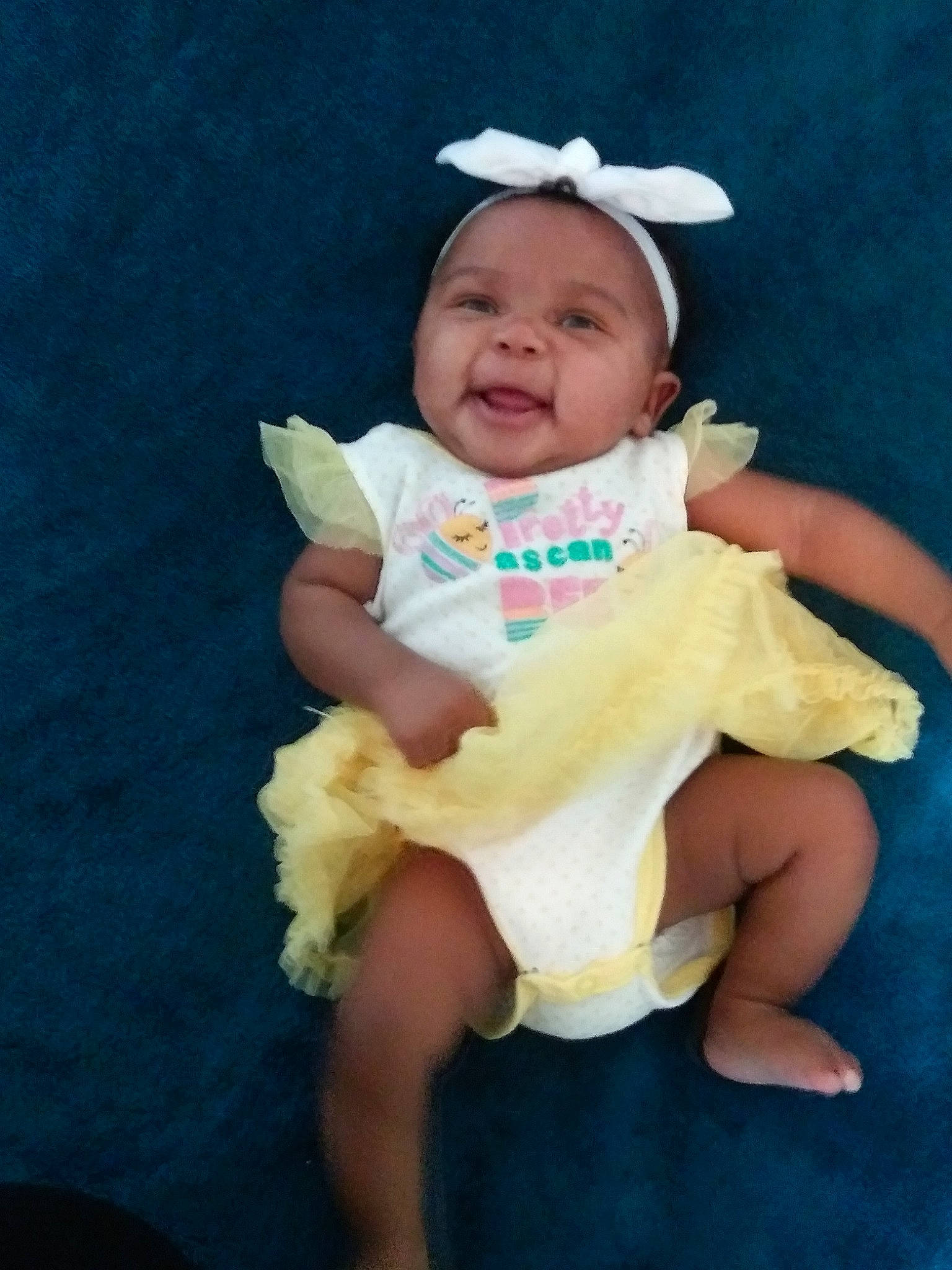 Nova Reign is registered to the contest to win money with this photo: baby, baby_toddler_clothing, child, facial_expression, fun, happy, person, product, sitting, skin, smile, toddler