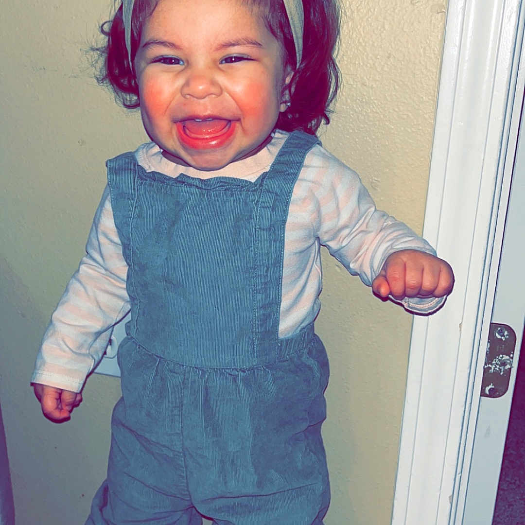 Alaïa is registered to the contest to win money with this photo: baby, bodypart, boot, clothing, coat, costume, door, dress, face, footwear, happy, hat, head, jacket, jeans, pants, person, photography, portrait, shoe