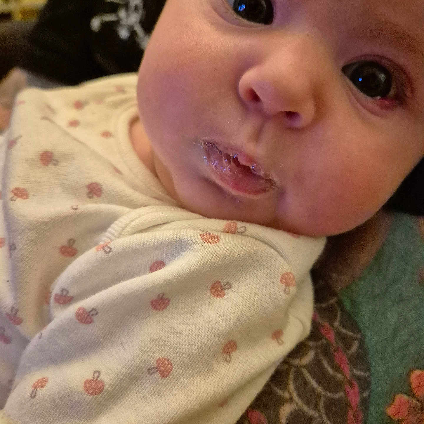 Phoebe is registered to the contest to win money with this photo: baby, blanket, bodypart, clothing, cushion, dress, face, finger, hand, head, homedecor, mouth, newborn, person, photography, portrait, quilt, selfie, spitting, teeth