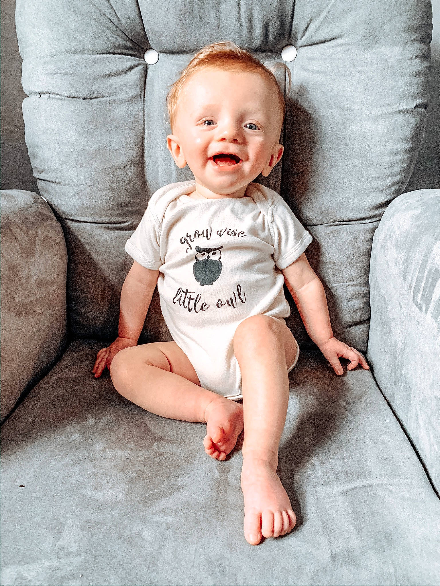 Brett joined the competition — help win amazing prizes! baby, baby_products, baby_toddler_clothing, barefoot, cheek, child, comfort, face, facial_expression, floor, flooring, head, leg, person, product, sitting, skin, sleeve, smile, t_shirt