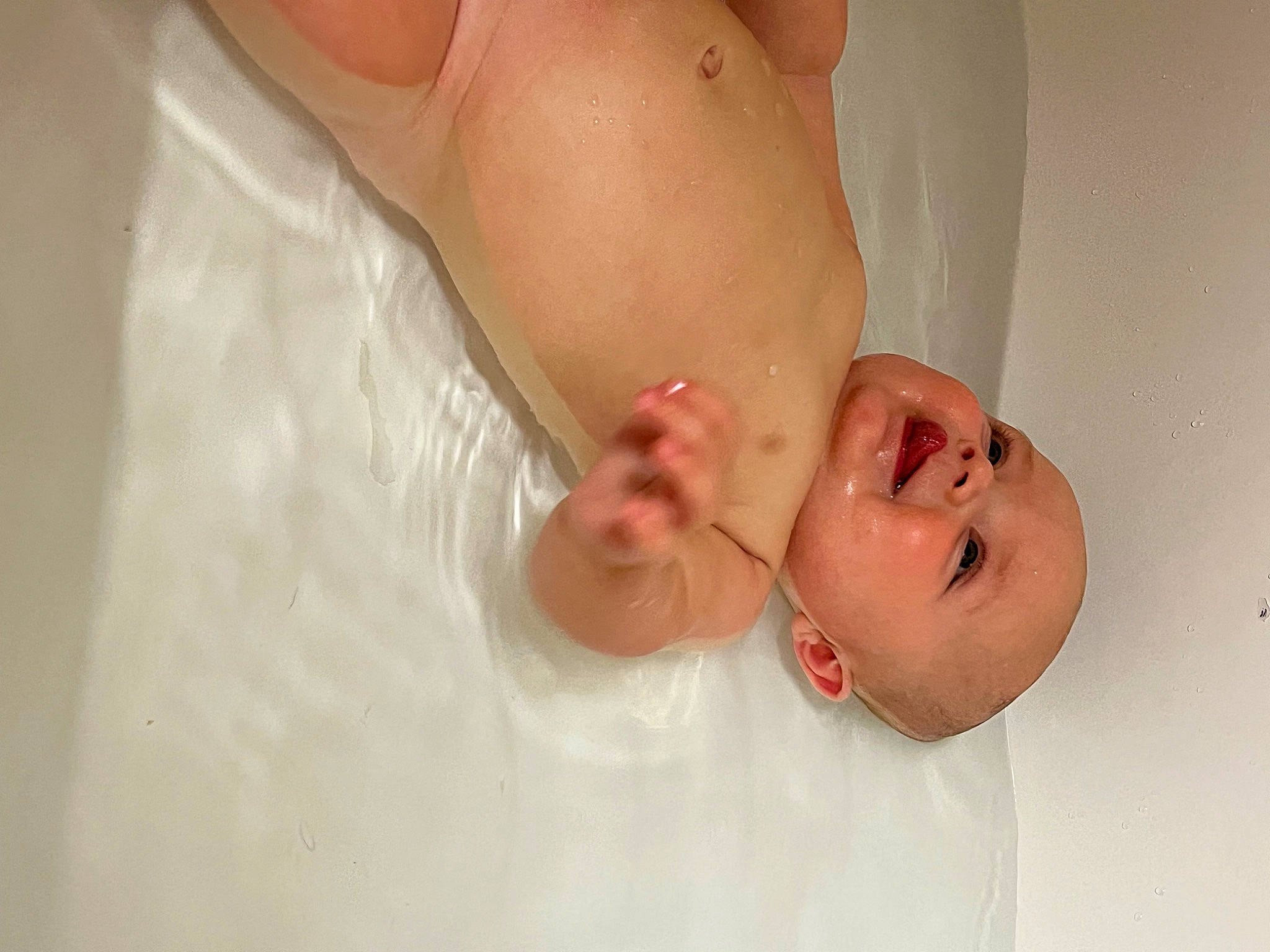 Griffin is registered to the contest to win money with this photo: arm, baby, baby_bathing, bathing, bathroom, bathtub, chest, comfort, fluid, gesture, hand, happy, human_body, person, plumbing_fixture, skin, smile, stomach, thumb, toddler