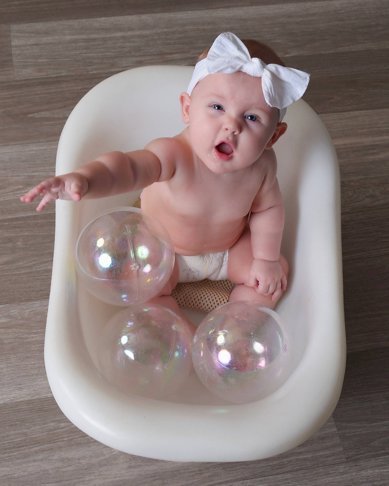Sailor is registered to the contest to win money with this photo: baby, baby_products, baby_toddler_clothing, baby_toys, bathing, child, circle, dishware, headwear, person, plastic, porcelain, product, serveware, sitting, tableware, toddler