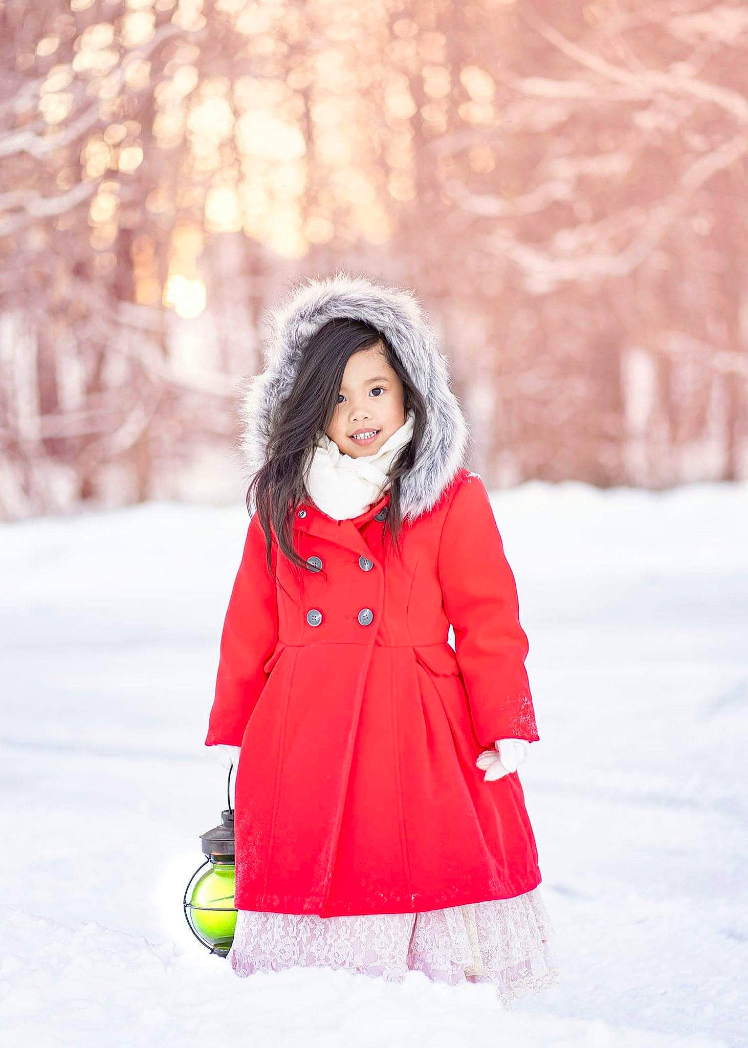 Saphira is registered to the contest to win money with this photo: beauty, child, child_model, clothing, coat, fashion, footwear, joy, orange, outerwear, person, photograph, photography, pink, red, skin, snapshot, snow, street_fashion, white