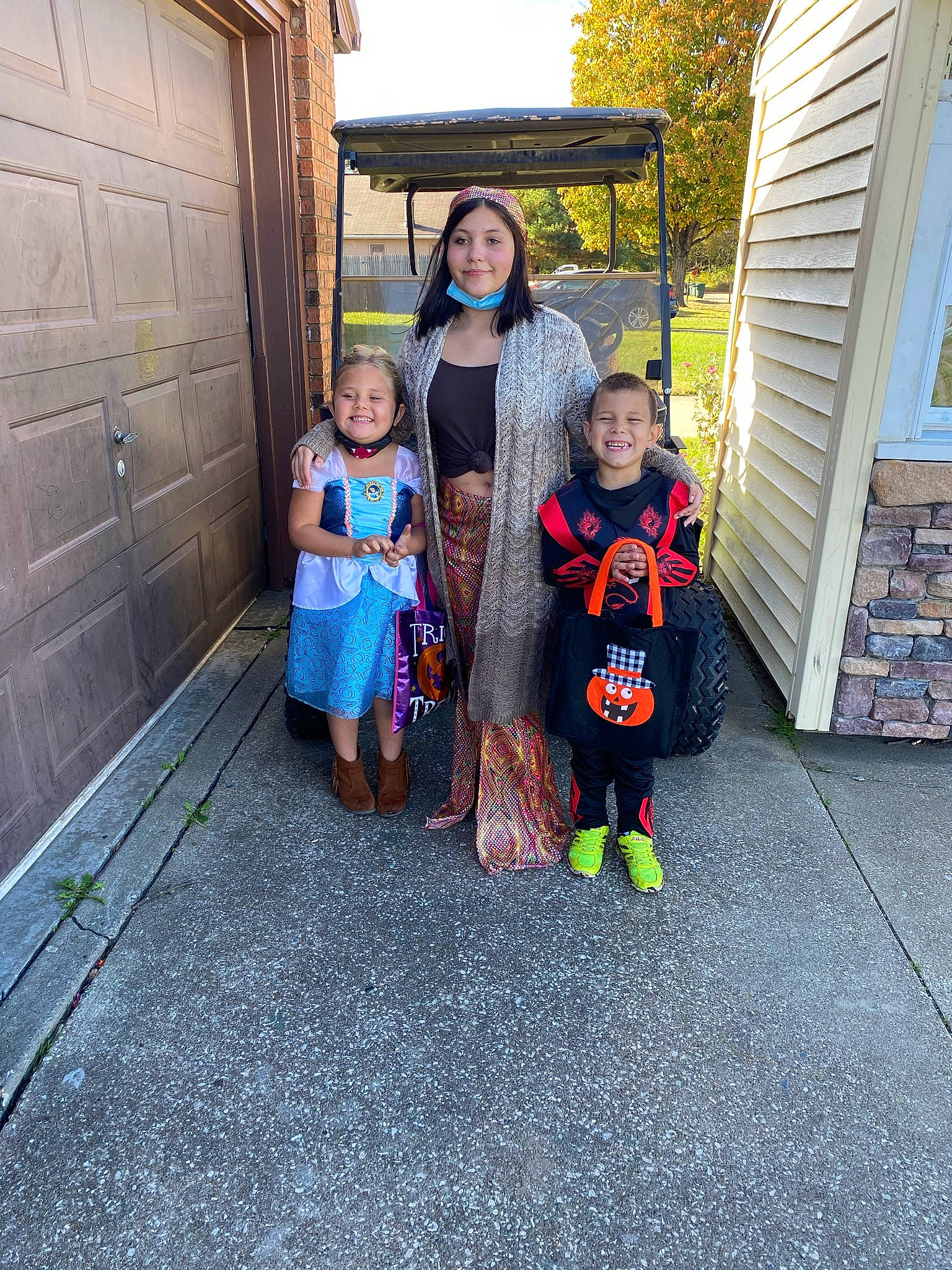 Milly is registered to the contest to win money with this photo: asphalt, child, door, dress, event, flooring, fun, grass, house, human_settlement, joy, leisure, person, public_space, road_surface, sidewalk, smile, standing, t_shirt, toddler