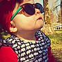 Karli Mae is registered to the contest to win money with this photo: baby, child, sunglasses, red_headband, outdoor, nature, trees, sunlight, face, profile, clothing, pattern, elephant_print, cute, portrait, person, young_child, fashion, headwear, seasonal
