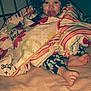 Karli Mae is registered to the contest to win money with this photo: child, toddler, blanket, bed, pacifier, curly_hair, foot, striped, floral, pajamas, indoor, cozy, face, person, cute, young, sleepwear, comfort, plush, rest
