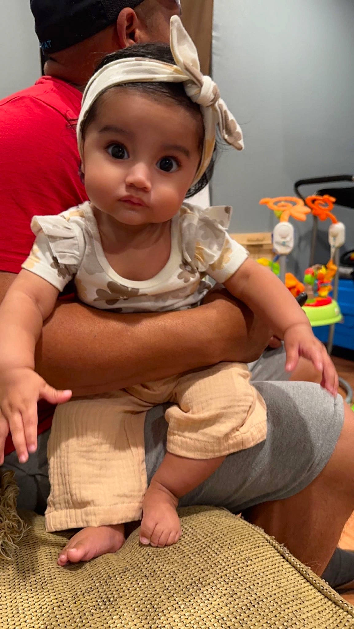Andrea joined the competition — help win amazing prizes! baby, baby_toddler_clothing, barefoot, cheek, child, chin, flooring, foot, fun, happy, head, headband, human, human_leg, person, sitting, skin, sleeve, t_shirt, thigh