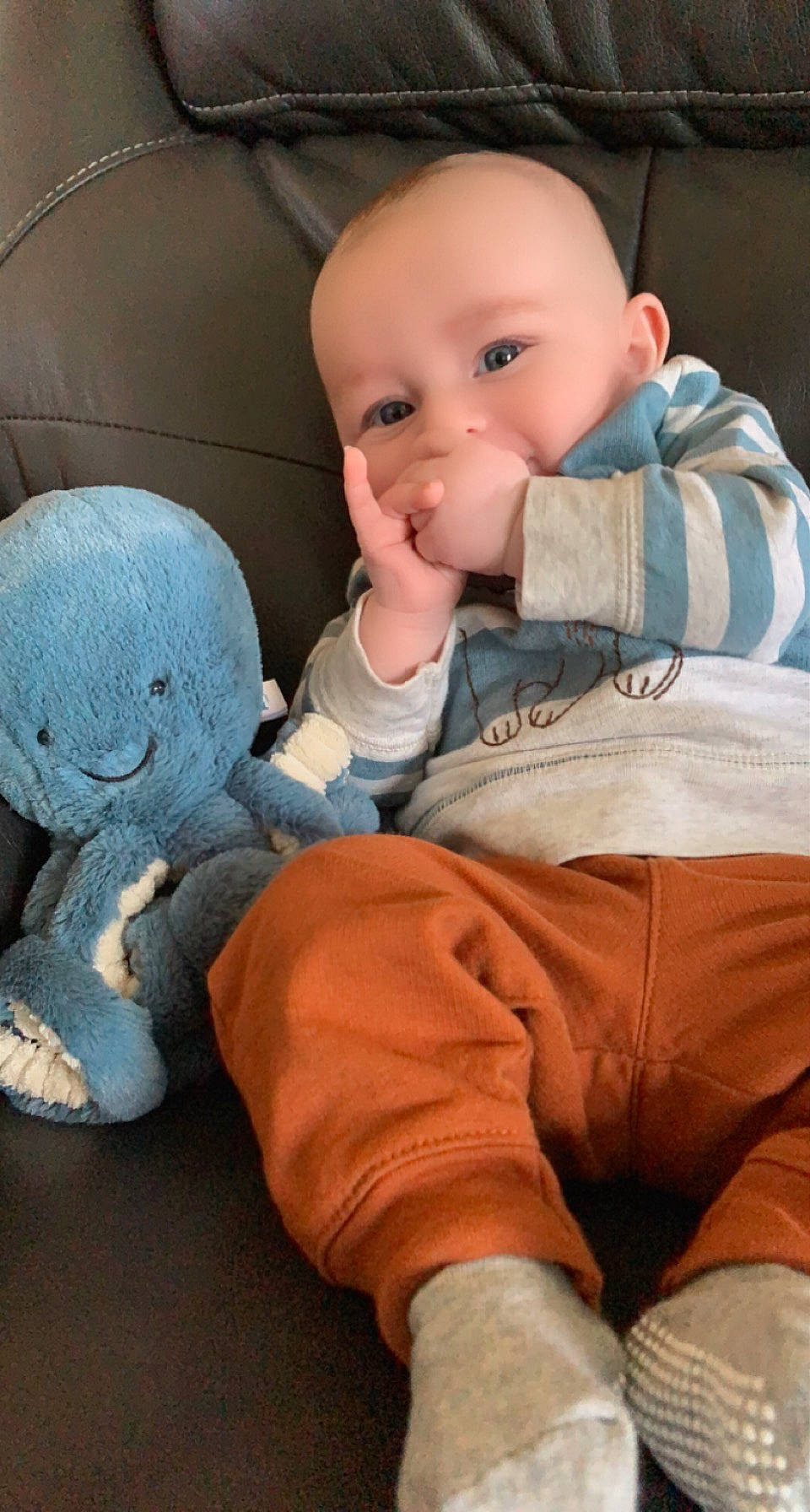 Elijah is registered to the contest to win money with this photo: baby, baby_products, baby_toddler_clothing, cheek, child, comfort, doll, finger, joint, mouth, nose, orange, people, person, sitting, skin, stuffed_toy, textile, thumb, toy