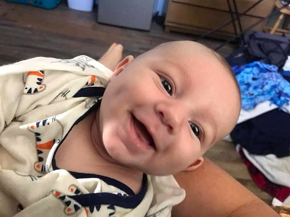 Elijah is registered to the contest to win money with this photo: baby, baby_toddler_clothing, blue, cheek, chin, eye, eyebrow, eyelash, facial_expression, forehead, hairstyle, happy, head, jaw, joy, lip, mouth, nose, person, skin