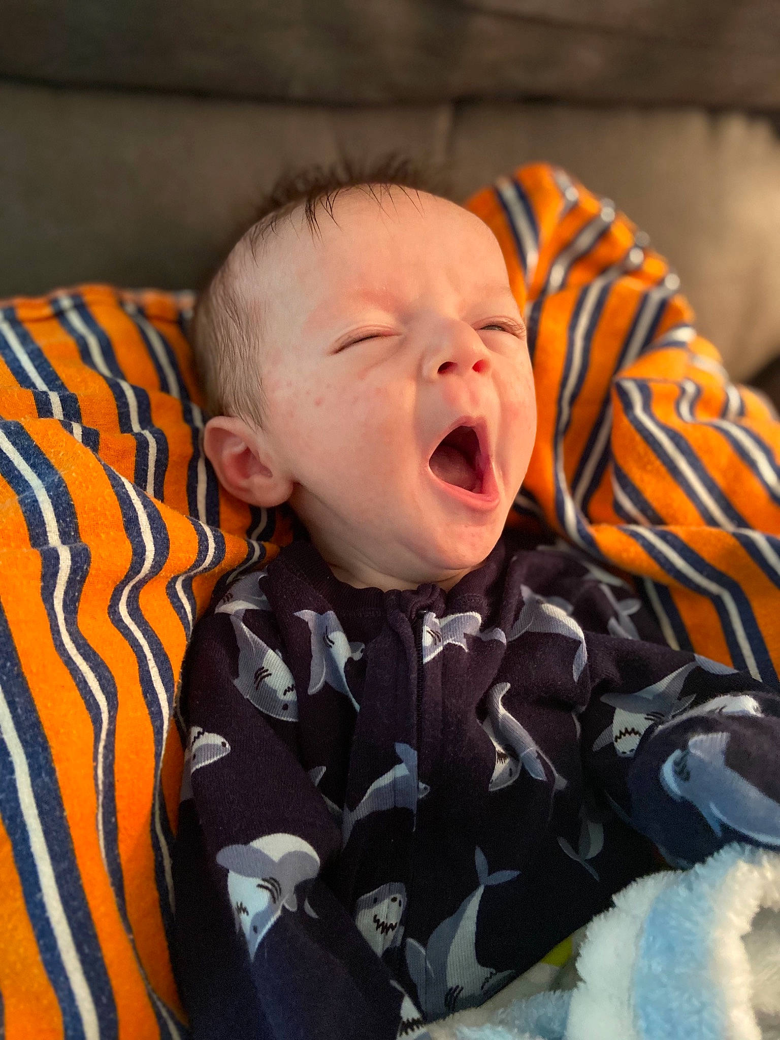 Colton joined the competition — help win amazing prizes! baby, baby_toddler_clothing, cheek, child, comfort, eye, face, flash_photography, fun, happy, head, iris, jacket, linens, orange, outerwear, person, sitting, sleeve, textile