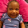 Azaliah joined the competition — help win amazing prizes! baby, child, smiling, purple_shirt, pink_flowers, cushion, pink_cushion, patterned_background, happy, portrait, infant, cute, resting, indoors, closeup, face, person, clothing, arm, skin