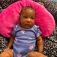 Azaliah is registered to the contest to win money with this photo: baby, black_and_white, blanket, child, comfort, cute, expression, face, floral_pattern, hand, head, indoors, infant, lying_down, onesie, patterned_blanket, pink_pillow, portrait, purple_clothing, skin
