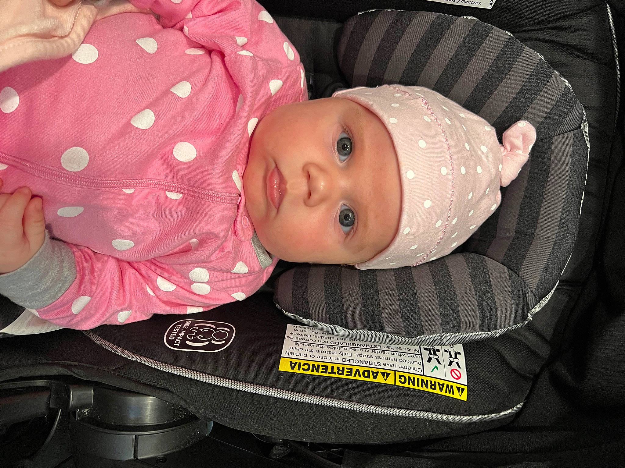 Alma is registered to the contest to win money with this photo: auto_part, baby, baby_carriage, baby_products, baby_safety, baby_toddler_clothing, cheek, child, comfort, hat, headgear, headwear, mouth, person, sleeve, toddler