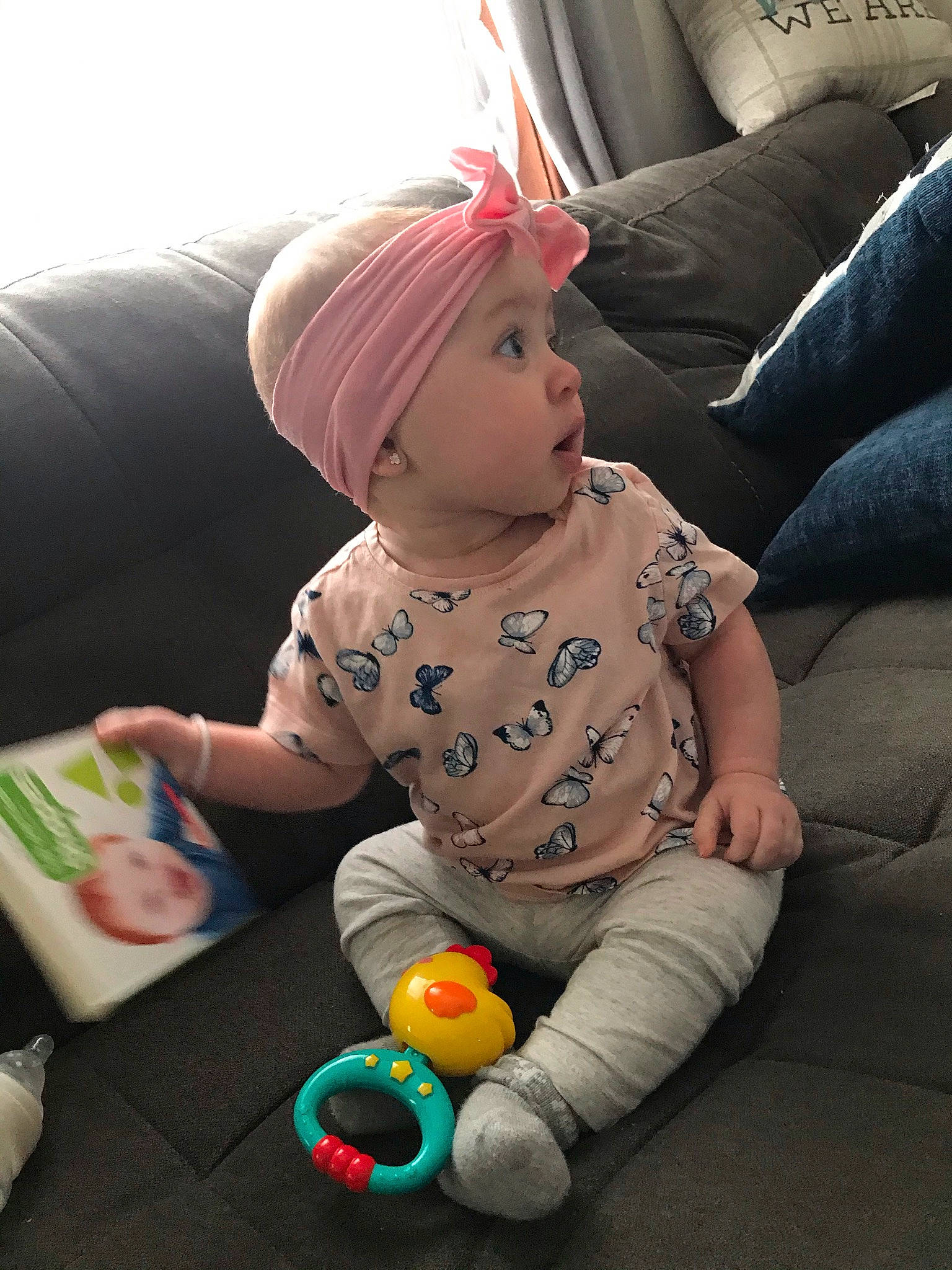 Tylynn joined the competition — help win amazing prizes! baby, baby_playing_with_toys, baby_products, baby_toddler_clothing, ball, cap, child, comfort, couch, flooring, fun, head, headwear, human_body, pattern, person, play, room, sitting, sleeve
