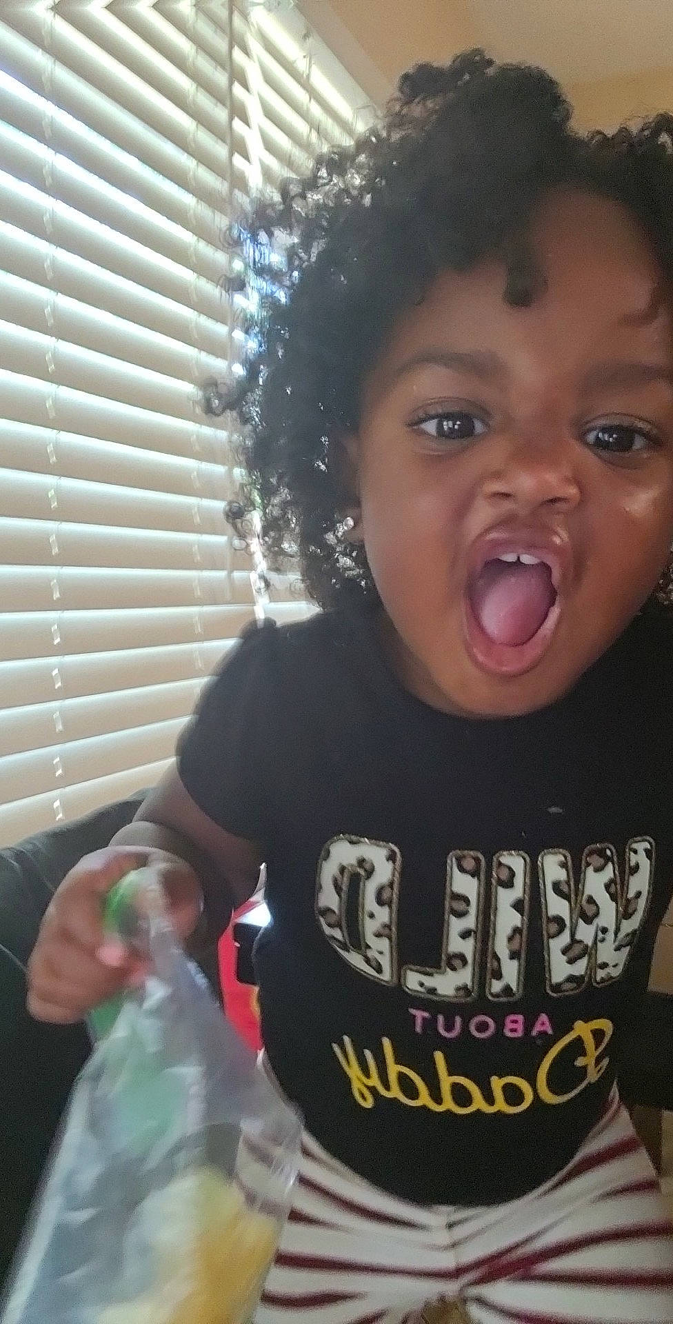 K'Nova is registered to the contest to win money with this photo: black_hair, cheek, cool, ear, eyelash, facial_expression, fun, gesture, happy, iris, lip, mouth, nose, organ, person, sleeve, smile, standing, surprise, t_shirt