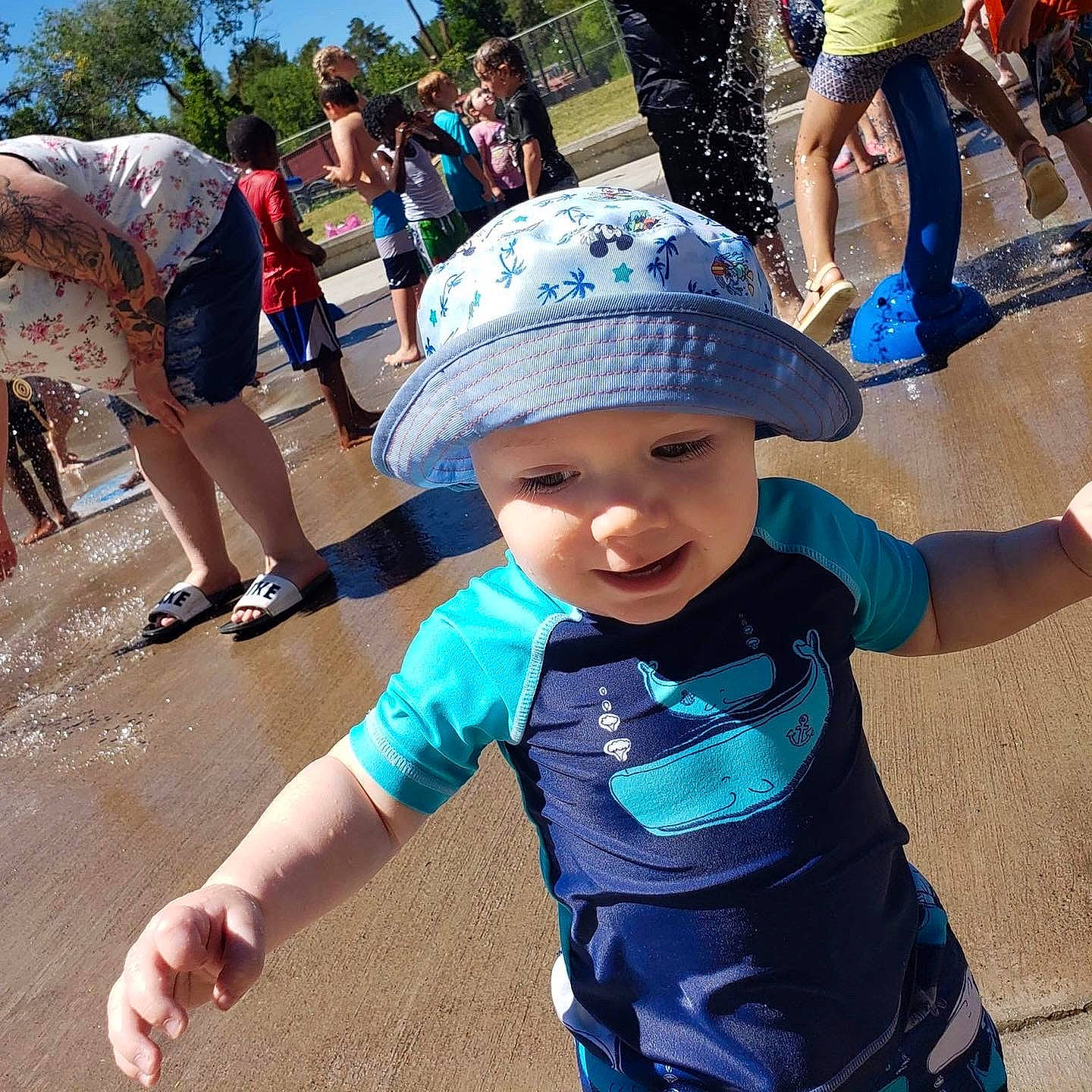 Roman is registered to the contest to win money with this photo: baseball_cap, blue, cap, cool, fun, happy, hat, headwear, leisure, mammal, morning, person, product, public_space, recreation, shorts, sun_hat, sunglasses, t_shirt, toddler