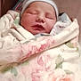 Miley joined the competition — help win amazing prizes! newborn, baby, blanket, floral, sleeping, crib, hat, face, infant, wrapped, cozy, soft, peaceful, child, cute, indoors, portrait, resting, baby_bed, newborn_baby