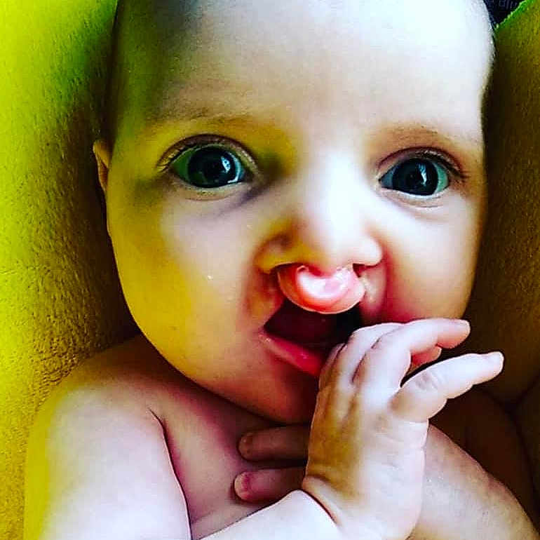 Reagan Brionna joined the competition — help win amazing prizes! baby, babylaughing, biting, bodypart, eating, face, finger, food, fruit, hand, happy, head, mouth, pear, person, photography, plant, portrait, produce, smile