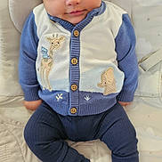 Elijah joined the competition — help win amazing prizes! baby, infant, child, sweater, blue_clothing, knitted, animal_patch, giraffe, elephant, toddler, cute, smiling, indoors, cushion, blanket, footwearless, portrait, seated, looking_at_camera, cozy