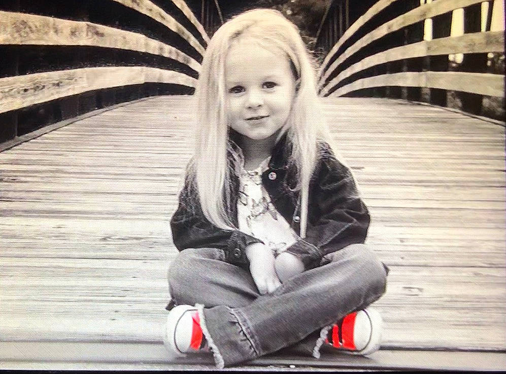 Emma is registered to the contest to win money with this photo: beauty, black_and_white, blond, child, child_model, cool, eye, footwear, hair, hairstyle, happy, long_hair, monochrome, person, photo_shoot, photograph, photography, portrait_photography, sitting, smile