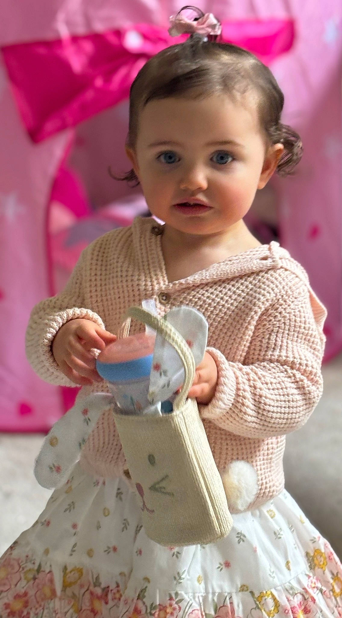 Bianca is registered to the contest to win money with this photo: baby, baby_toddler_clothing, cheek, child, dress, drinkware, fashion_accessory, fun, hairstyle, happy, head, jewellery, magenta, pattern, person, pink, product, skin, sleeve, toddler