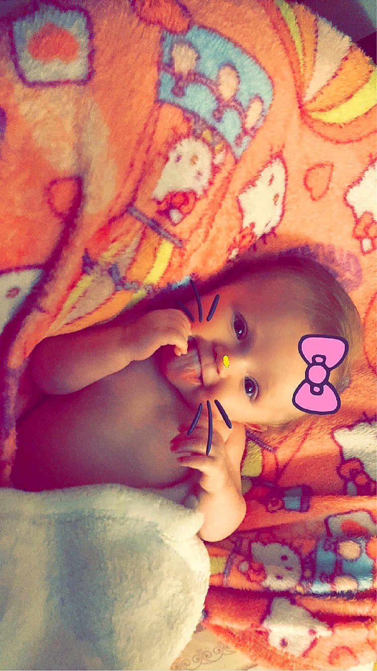 Evelynn joined the competition — help win amazing prizes! baby, blanket, cartoon, colorful, cute, digital_filter, face, hand, infant, lying_down, nostalgia, pink_bow, playful, portrait, skin, tongue_out, whiskers, young_child, cozy, wrapped