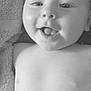 Tommy is registered to the contest to win money with this photo: baby, infant, smile, tongue, close_up, portrait, black_and_white, towel, skin, face, child, cute, happy, expression, head, lying_down, young, person, indoors, soft_texture