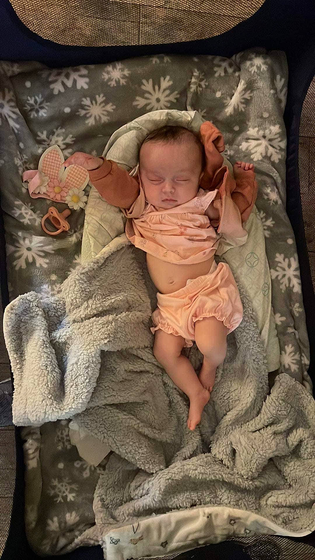 Brooklyn is registered to the contest to win money with this photo: baby, baby_products, baby_sleeping, baby_toddler_clothing, bed, cheek, child, comfort, dress, eye, foot, human_body, human_leg, infant_bed, linens, pattern, person, room, sitting, sleeve
